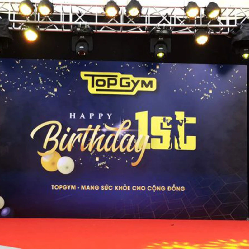 Thiết Kế Backdrop Chuyên Nghiệp - Bí Quyết Nâng Tầm Sự Kiện Của Bạn Backdrop sinh nhật phòng gym Top Gym lần thứ 1 – thiết kế sang trọng, màu xanh navy, thi công bởi Quảng Cáo Sắc Màu.