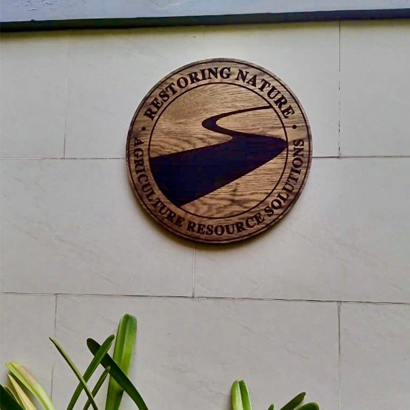 Bảng hiệu gỗ khắc laser với họa tiết Restoring Nature, thiết kế mộc mạc và tinh tế